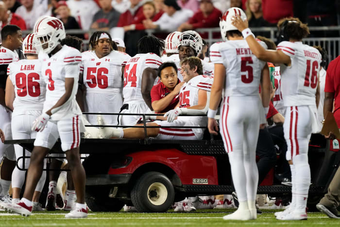 Wisconsin tight end Clay Cundiff being carted off the field against Ohio State.